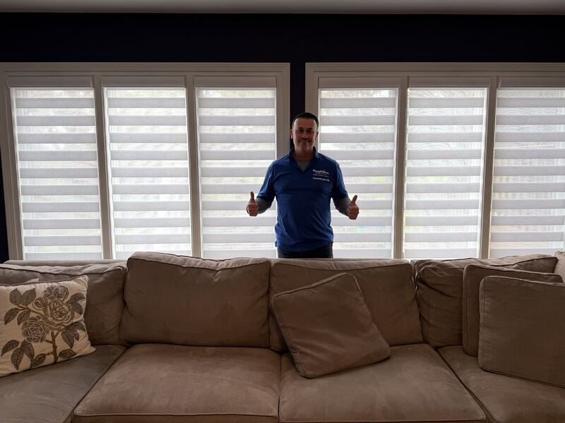 Mike Franzone in front of a finished installation