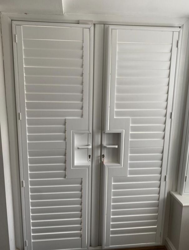 A matched pair of French doors, each panel built with its own handle cut-out.