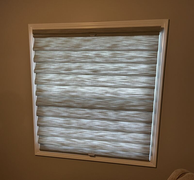 A Vignette Modern Roman Shade in a single specialty window.